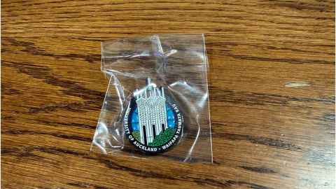 Clock Tower pin on a wooden table