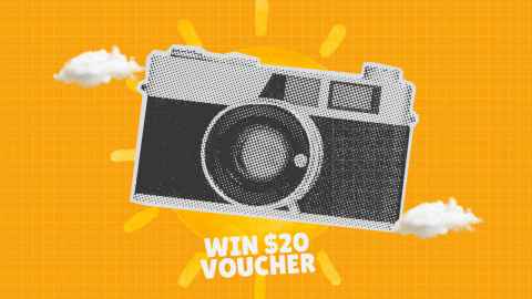 A camera in front of a sunshine yellow background