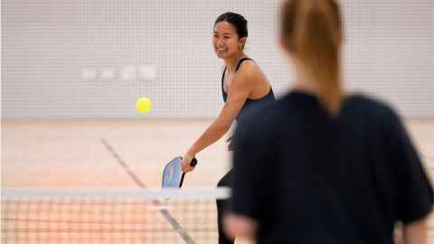 Student playing pickleball at Hiwa