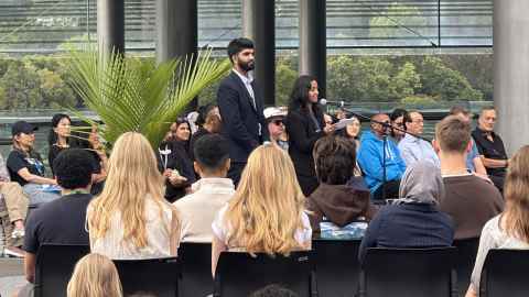 A man and women speaking to a crowd