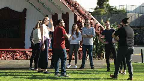 Photo of international students outside Waipapa Marae. 