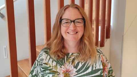 Photo of Amy Cameron smiling at the camera. 