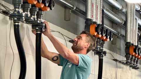 Andrew Reid working on the pumps
