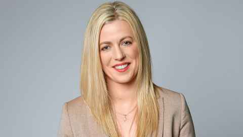 Photo of Sinead Johnston smiling at the camera. 