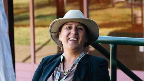 Kohu Hakaraia, Kaimanaaki Kaupapa at Te Tumu Herenga smiling at the camera wearing a white hat