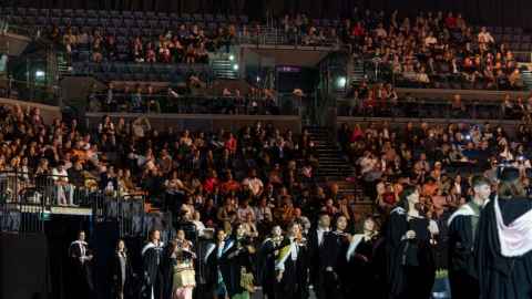 Photo of a graduation ceremony inside Spark Arena. 