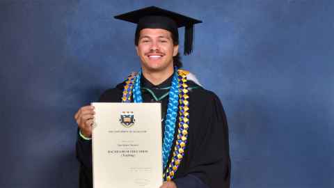 Photo of Tane Marsters in his graduation regalia.