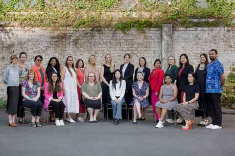 Photograph of Professional Staff outside of the Auckland Law School building.