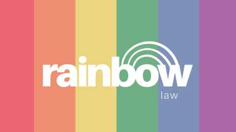 The words 'Rainbow law' on a rainbow flag.
