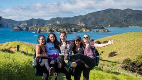 students posing in nature during a hike