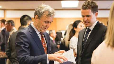 Man reading the Auckland University Law Review (Journal)
