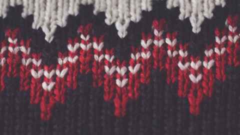 White, red and black knitted pattern