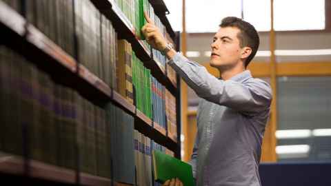 student in library