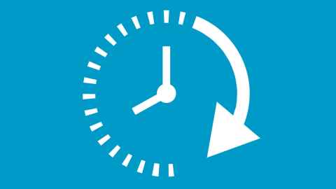 A stencil of a white clock on a turquoise background. 