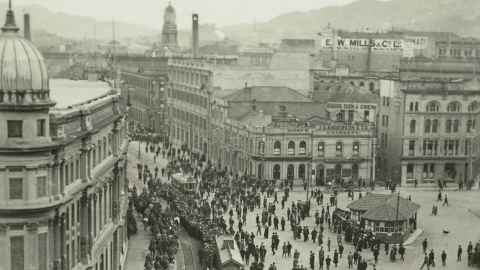 A vintage photograph of labourers walking in the street