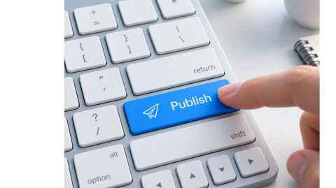 Image of finger pressing publish button on a keyboard.