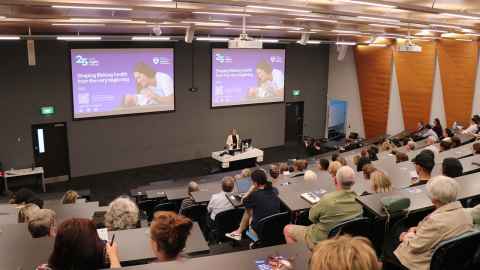 MC Prof Katie Groom introducing public lecture 'The Good Sh*t'