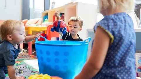 Children playing with toys in the Clinical Research Unit