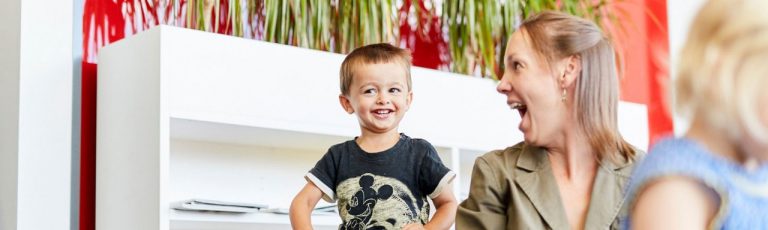 Researcher and children in the Clinical Research Unit