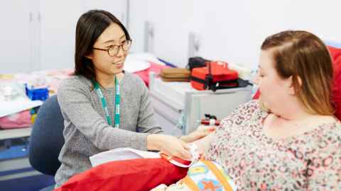 Pregnant mother participating in clinical trial