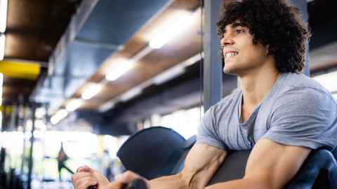 Health male exercising in gym