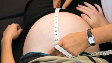 Fundal height of pregnant woman being measured