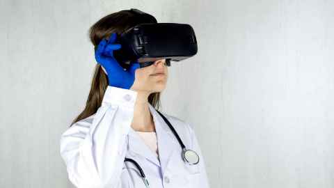 Doctor wearing VR headset