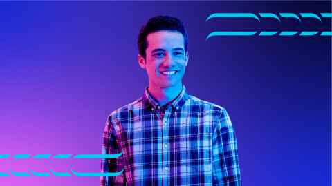 Student smiling with purple background.