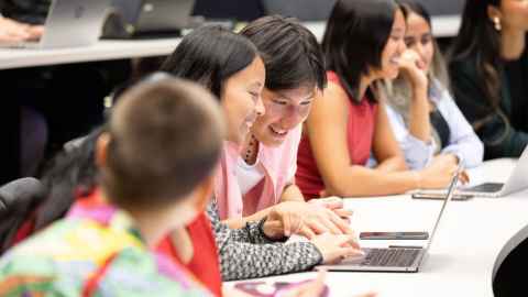 students looking at a laptop screen