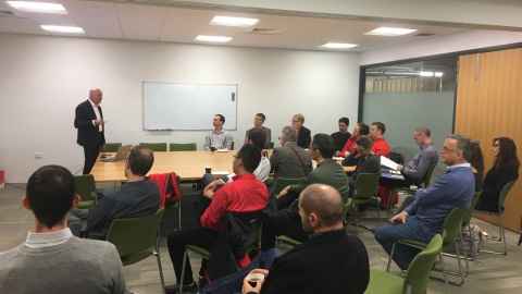 Group of people seated around a table