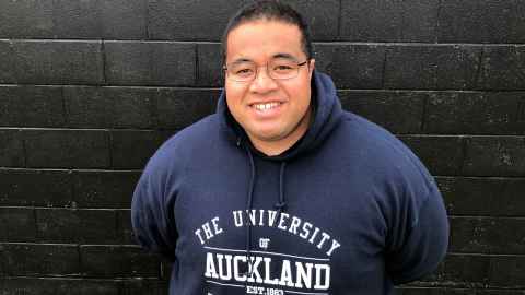 Frank Tasi wearing an University of Auckland hoodie