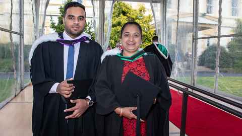 New teacher Rohini Lal is pictured, graduating with a Bachelor of Education (Teaching) on the same day as her son Ronish received a Bachelor of Engineering (Electrical).