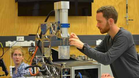 Tino Hermann working with lab equipment