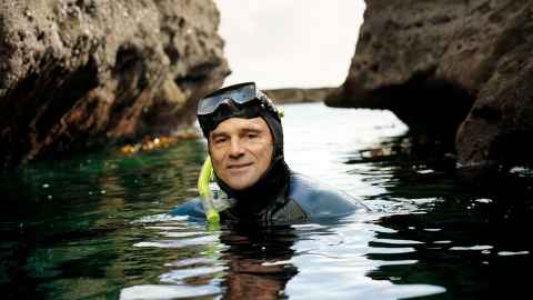 Professor John Montgomery in water with snorkel
