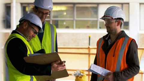 Professor Jason Ingham, Dr Rick Henry, Dr Liam Wotherspoon wearing high-vis vests and white hard hats