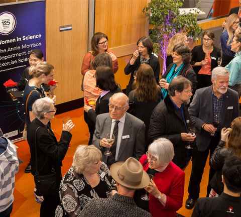 Distinguished guests celebrate the naming of the Kathleen Curtis Atrium.