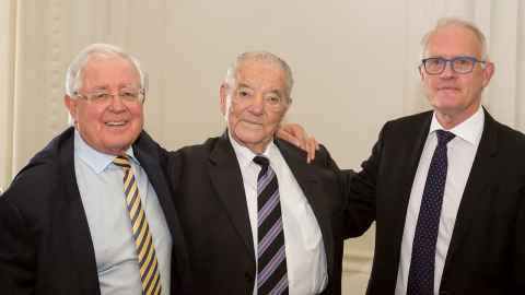 Sir Richard Faull, Sir David Levene and Vice-Chancellor Professor Stuart McCutcheon with arms around each other's shoulders
