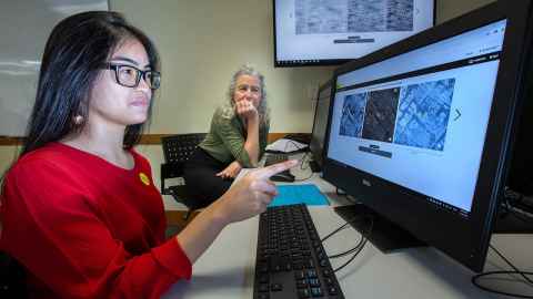 Keeara Ofren pointing at a computer monitor