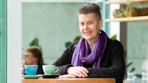 Dr Hilary Chung at a cafe table