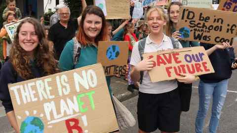 School students holding placards