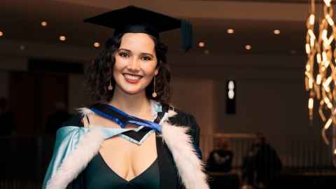 Hannah Watson wearing academic regalia