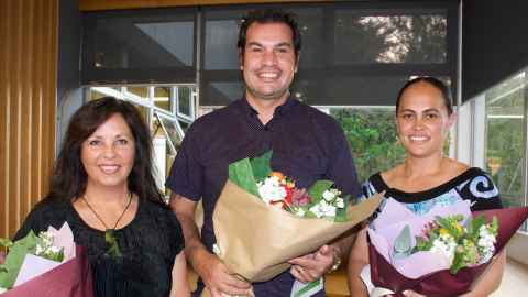 Debra-Kim Croggon, Eruera Abraham and Rita Burgess holding bouquets of flowers