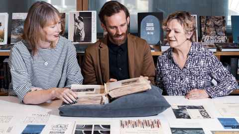 Finn McCahon-Jones with Caroline McBride and Catherine Hammond from the Auckland Art Gallery researching Colin McCahon’s days as a curator.
