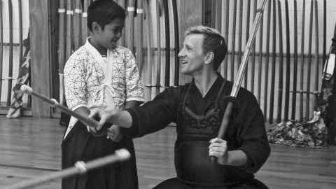 Black-and-white picture of Dr Blake Bennett and a kendo student Santino.