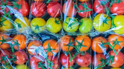 Packets of tomatoes in clear plastic packaging