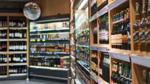 Shelves of bottles inside a liquor store