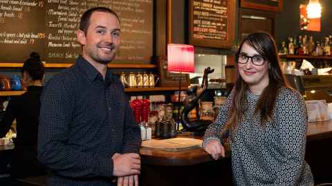 Associate Professor Liam Wotherspoon and Dr Rebecca Deed at the bar in a restaurant