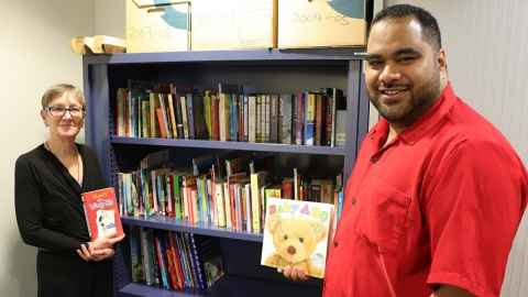 Sione Taufa and Herena Newall with donated books
