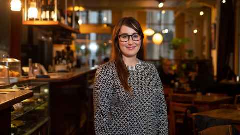 Rebecca Deed standing near the counter in a restaurant