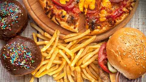 Burgers, chips, doughnuts and pizzas are pictured: It is hard to compete with the density of fast food outlets with pervasive advertising and signage in their neighbourhoods, says West Auckland parents. Photo: iStock